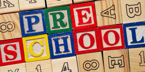 wooden blocks spell out the word preschool